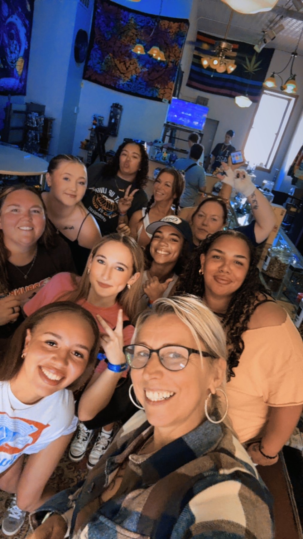 Customers and staff hanging out at Just-Us High Vibes