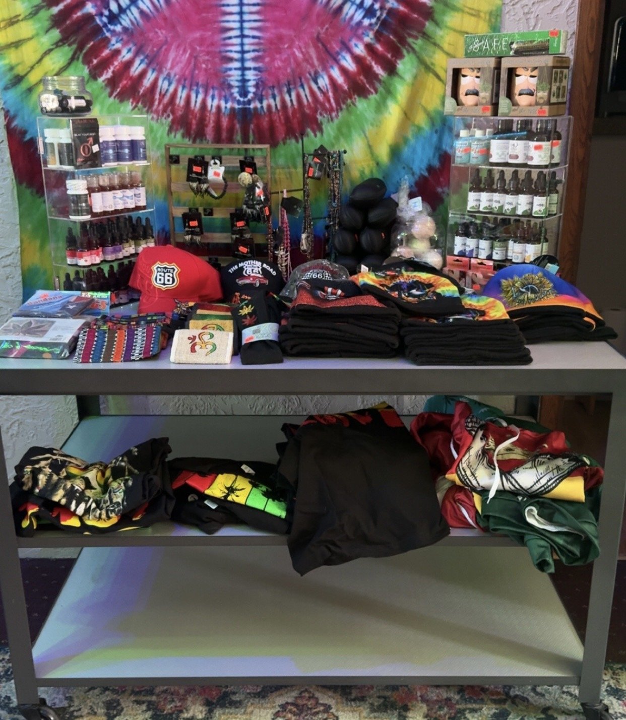 Just-Us High Vibes apparel and merch table